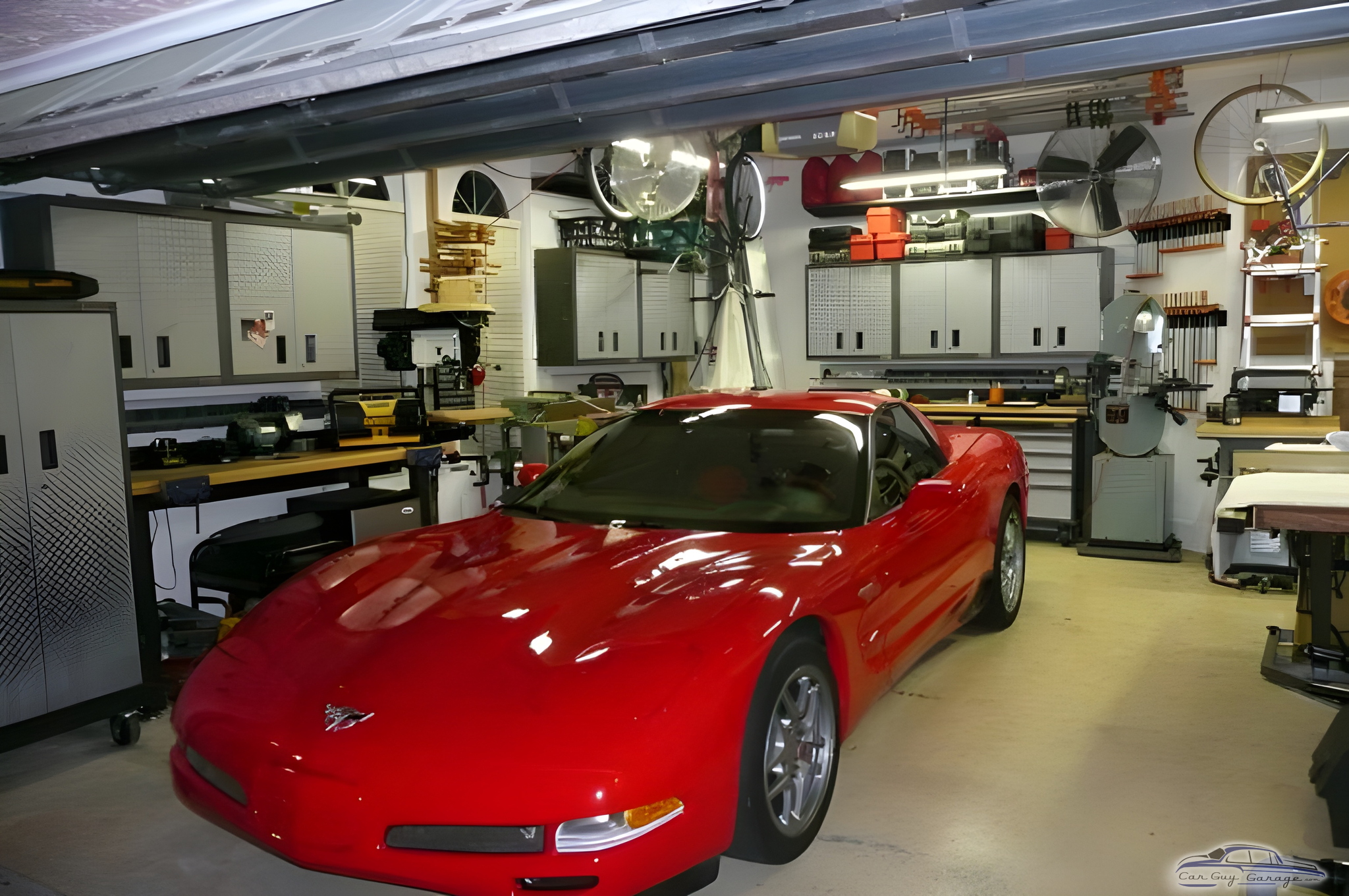 Organized garage with red sports car and storage cabinets - John from Plantation, FL