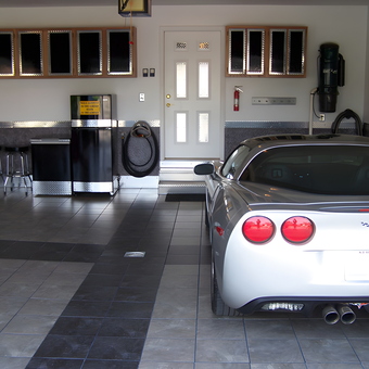 Organized garage with diamond plate cabinets and Corvette - Chad from Morton, IL