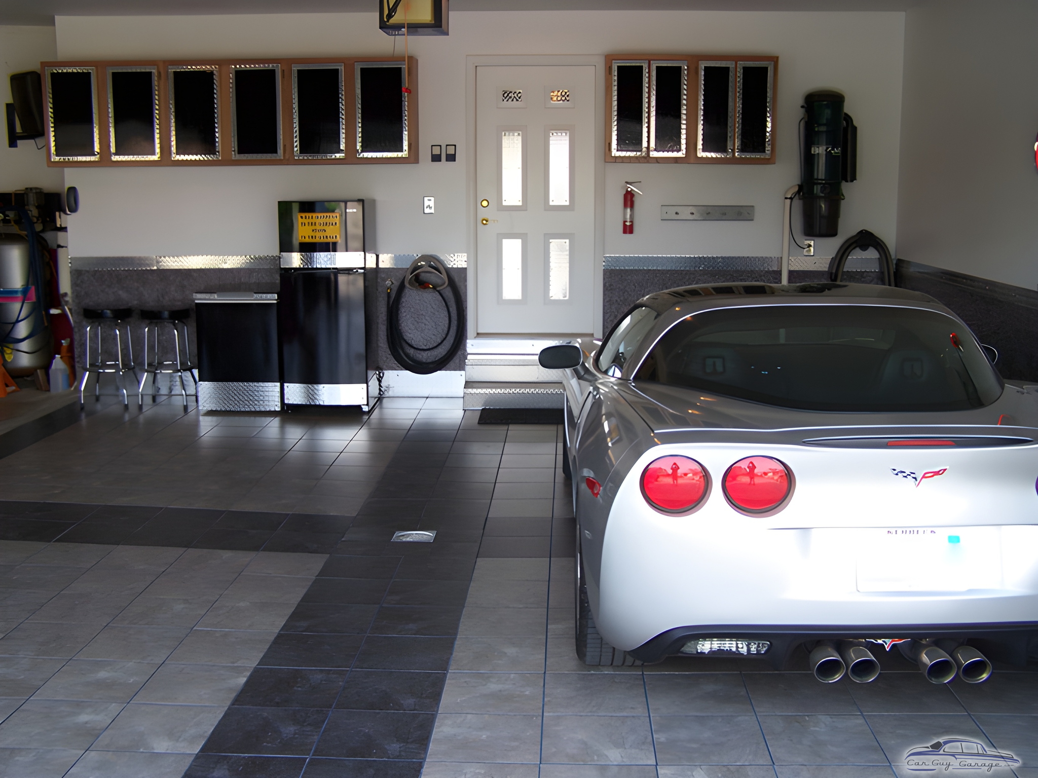 Organized garage with diamond plate cabinets and Corvette - Chad from Morton, IL