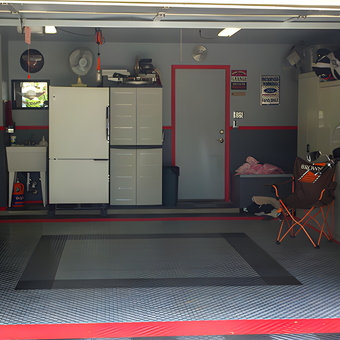 Organized garage with cabinets, flooring, and motorcycle - Jim from Austin, TX