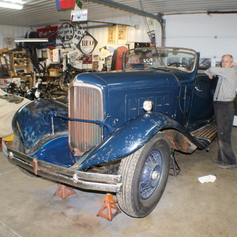 Classic Blue Convertible and Vintage Signs in Garage - Richard from Lansing, Mich