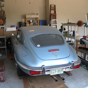 Organized garage with classic car, shelves, and tools - VeeTwelve from Round Rock, Texas