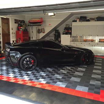 Custom garage with black sports car and checkered tiles - Rocket