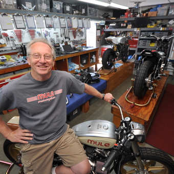 Organized Motorcycle Workshop with Tools and Workbenches - Richard