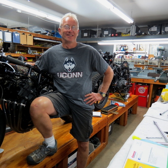 Organized Motorcycle Workshop with Tools and Benches - Richard