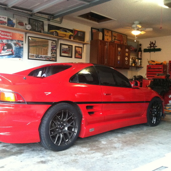 Red sports car, tool chests, cabinets, and wall decor - Randy from Orlando, FL