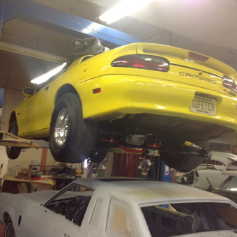 Yellow Camaro on Hydraulic Lift in Garage - Big Daddy Fetch from Branchburg, New Jersey