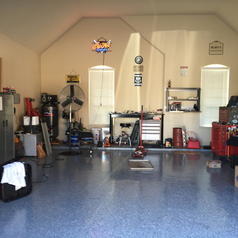 Organized garage with tool chests, cabinets, and workbenches - Garage Mahal from Tomball, Texas