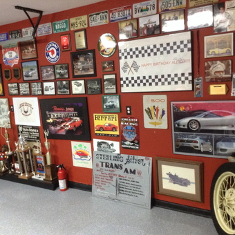 Garage Wall With Car Signs, Trophies, and Art - Dads MANCAVE