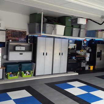 Organized garage with diamond plate cabinets and bike racks - S2online from Richmond, TX