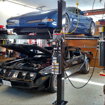 Garage with Car Lift, Classic Cars, and Storage Shelves - Bill from Boxford, MA