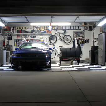 Organized garage with checkered floor tiles and wall storage - Craig from Port Washington, WI