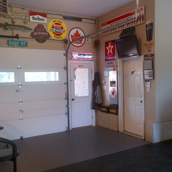 Garage with Vintage Signs, Bar Stools, and TV - Pete's Garage from London, Ontario