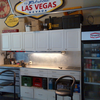 Organized garage with cabinets, tool chest, and Texaco fridge - Pete's Garage from London, Ontario