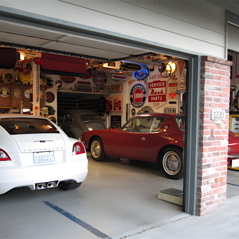 Classic Car Garage with Vintage Signs and Gas Pumps - Lance Lambert