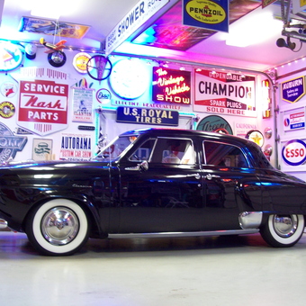 Classic Car with Vintage Garage Signs and Neon Lights - Lance Lambert