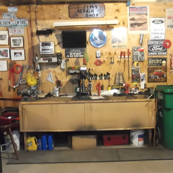 Organized garage workspace with tool chest and signs - Jim from Keshena, Wisconsin