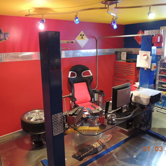 Custom garage office with lift, tool chest, and diecast cars - Andre Lechasseur from Pointe Calumet, Quebec