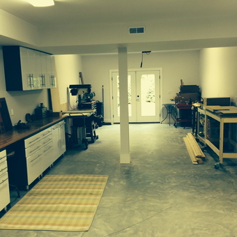 Organized garage with cabinets, workbenches, and tool storage - Rjlsat from Delray Beach, FL