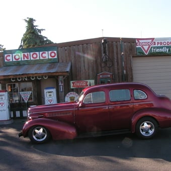 Vintage Gas Pumps and Classic Car at Retro Garage - Layle willis from Rigby, Idaho