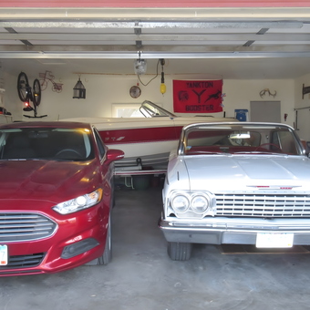Organized garage with classic cars, boat, and tools - John from Yankton, South Dakota