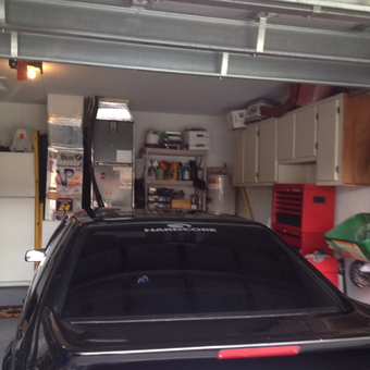 Organized Garage With Black Sports Car and Storage Cabinets - Kurt from Margate, Florida