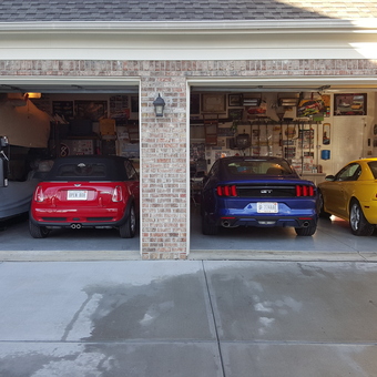 Organized Three-Car Garage with Car Lift and Wall Storage - REB from WESTFIELD, Indiana