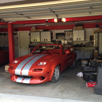 Red sports car and wall cabinets in garage - Cory from Newbury park, Ca
