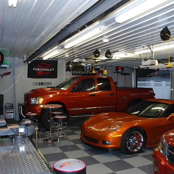 Custom garage with orange vehicles and racing decor - Mark from Perrysville, Ohio