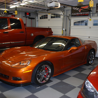 Custom Garage with Orange Corvette, Dodge Truck, and Racing Decor - Mark from Perrysville, Ohio