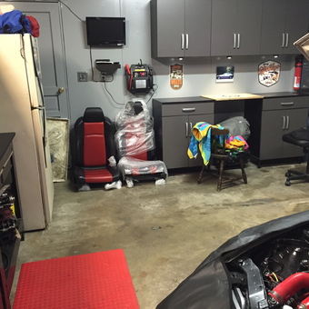 Organized garage with cabinets and car seats - David from Frederick, Md