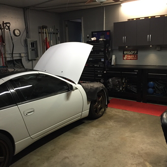 Organized garage with tool storage and white car - David from Frederick, Md