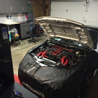 Organized garage with workbench, cabinets, and car lift - David from Frederick, Md