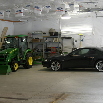 Organized garage with tractor, Mustang, and storage shelves - ScodeMike from Monument, Colorado