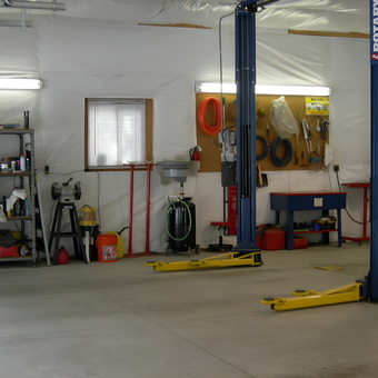Organized garage with car lift, shelving, and tools - ScodeMike from Monument, Colorado