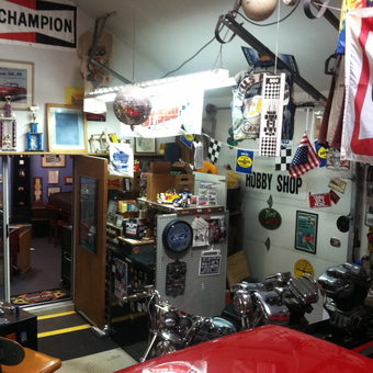 Garage Decor with Signs, Trophies, Motorcycles, and Flags - Tc