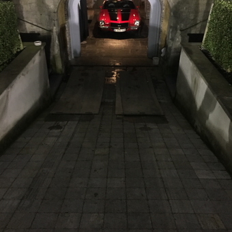 Classic red muscle car in stone garage entrance - Marc from Schoten, Antwerp