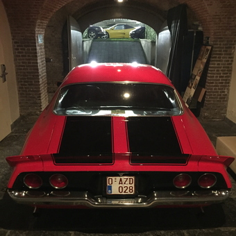 Classic red muscle car in arched brick garage - Marc from Schoten, Antwerp