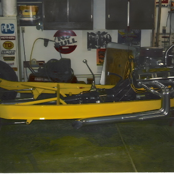 Yellow Hot Rod Chassis and Chrome Exhaust in Garage - Storm from Austintown, Ohio