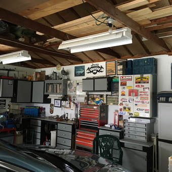 Organized garage with tool chests, cabinets, and wall decor - Larry from Kalamazoo, Michigan