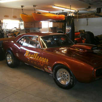 Garage with Race Car, Hanging Kayaks, and Storage Cabinets - AL