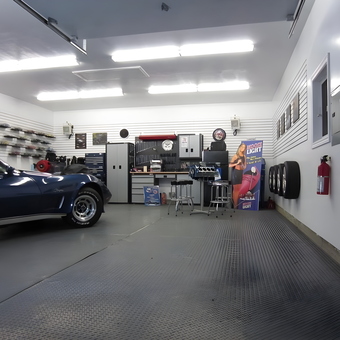 Organized garage with workbench, car, and wall storage - Tepot from Shediac, NB