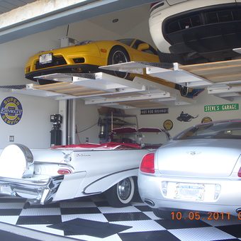 Luxury Cars on Garage Lifts with Retro Signs - Steve from Smithtown, NY