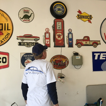 Vintage Gas Pump Signs and Wall Art in Garage - Popytop from Kalamazoo, Michigan