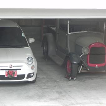 Modern Fiat and Classic Car on Dollies in Garage - Pappabob from St. Helena, California