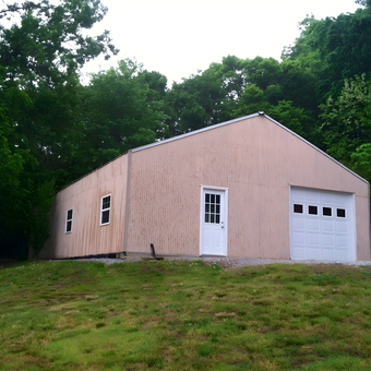 Beige Detached Garage With White Door and Windows - Rick Worth from Elmwood, Tennessee