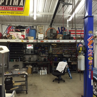 Organized garage with car lift, workbench, and tools - Mike from Palmer, Texas