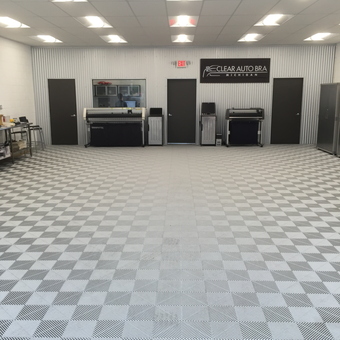 Modern garage with checkered floor tiles and storage cabinets - Larry from Plymouth, Mi