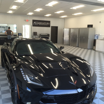 Modern garage with Corvette, metal cabinets, and tile floor - Larry from Plymouth, Mi