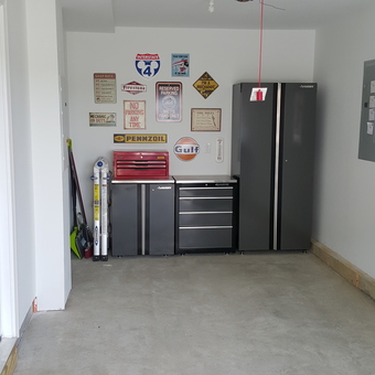 Organized garage with Husky cabinets and wall signs - Andrew N from Ocean, New Jersey